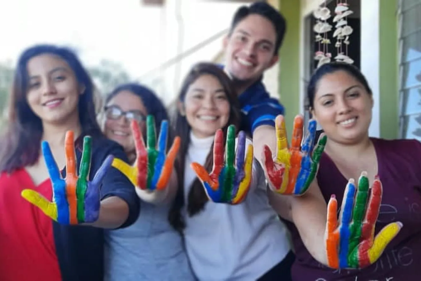 Participants of the Cancer Advocacy Programme showing their coloured hands