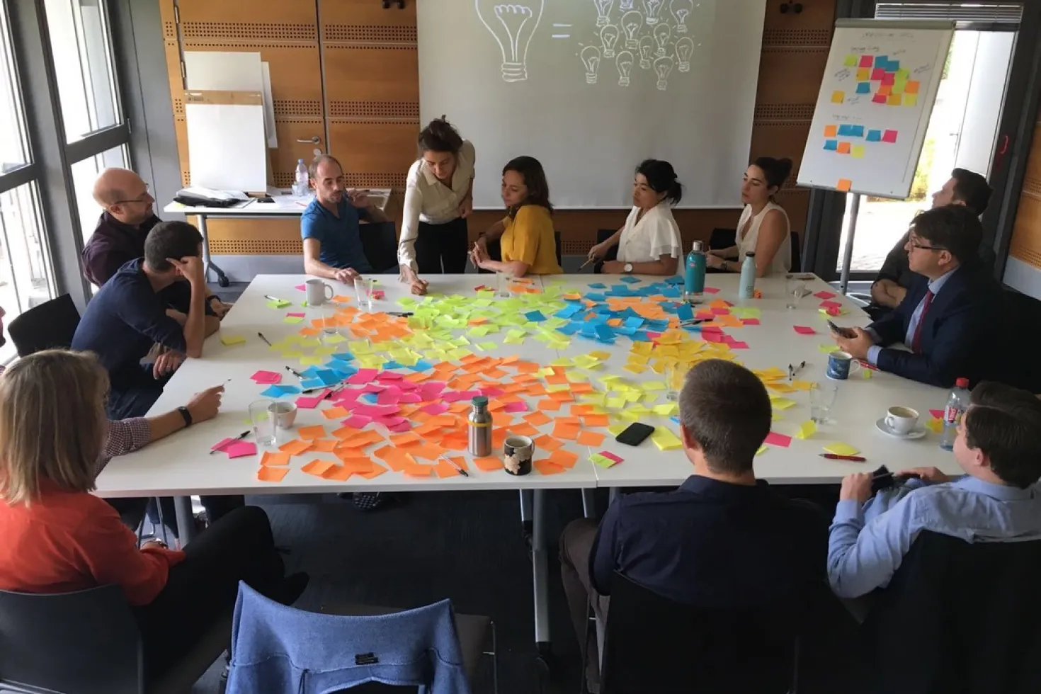 UICC staff brainstorming around the table