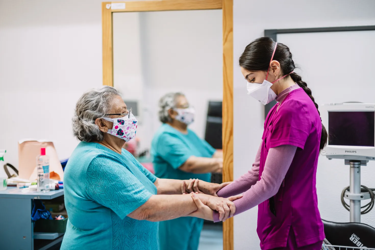 Patient and healthcare professional doing exercises