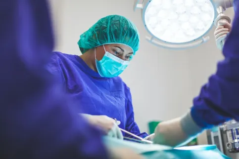 Doctor operating on a patient