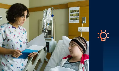 Nurse talking to patient in hospital