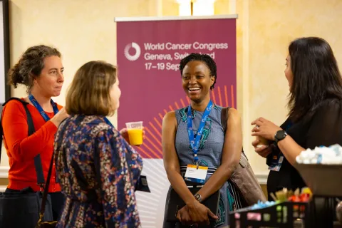 Four women at a medical conference talking