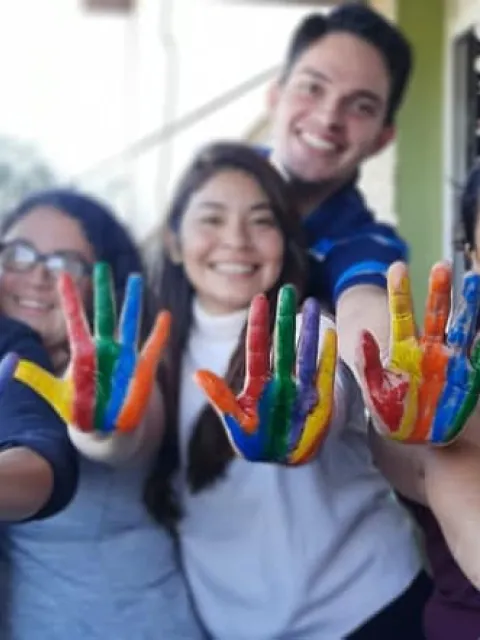 Participants of the Cancer Advocacy Programme showing their coloured hands
