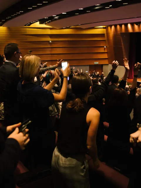 Participants cheering at the World Cancer Congress 2018