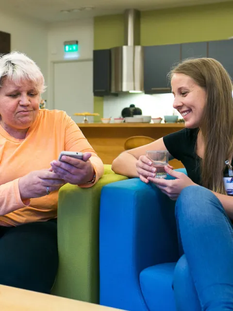 Two women discussing