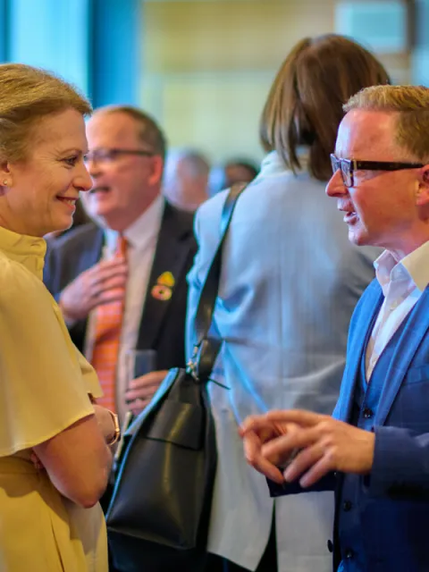 Two people at a UICC event